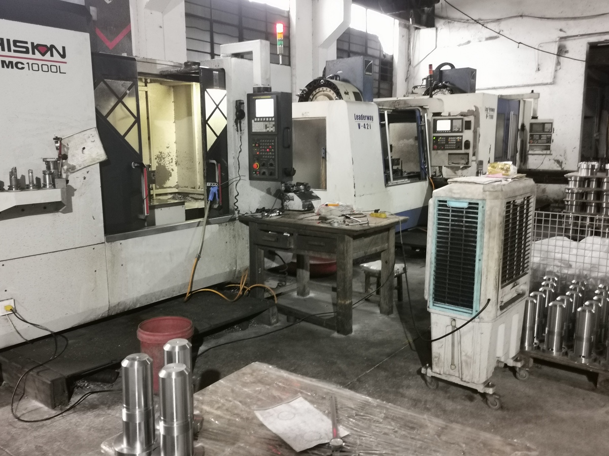 CNC machining workshop floor with precision equipment